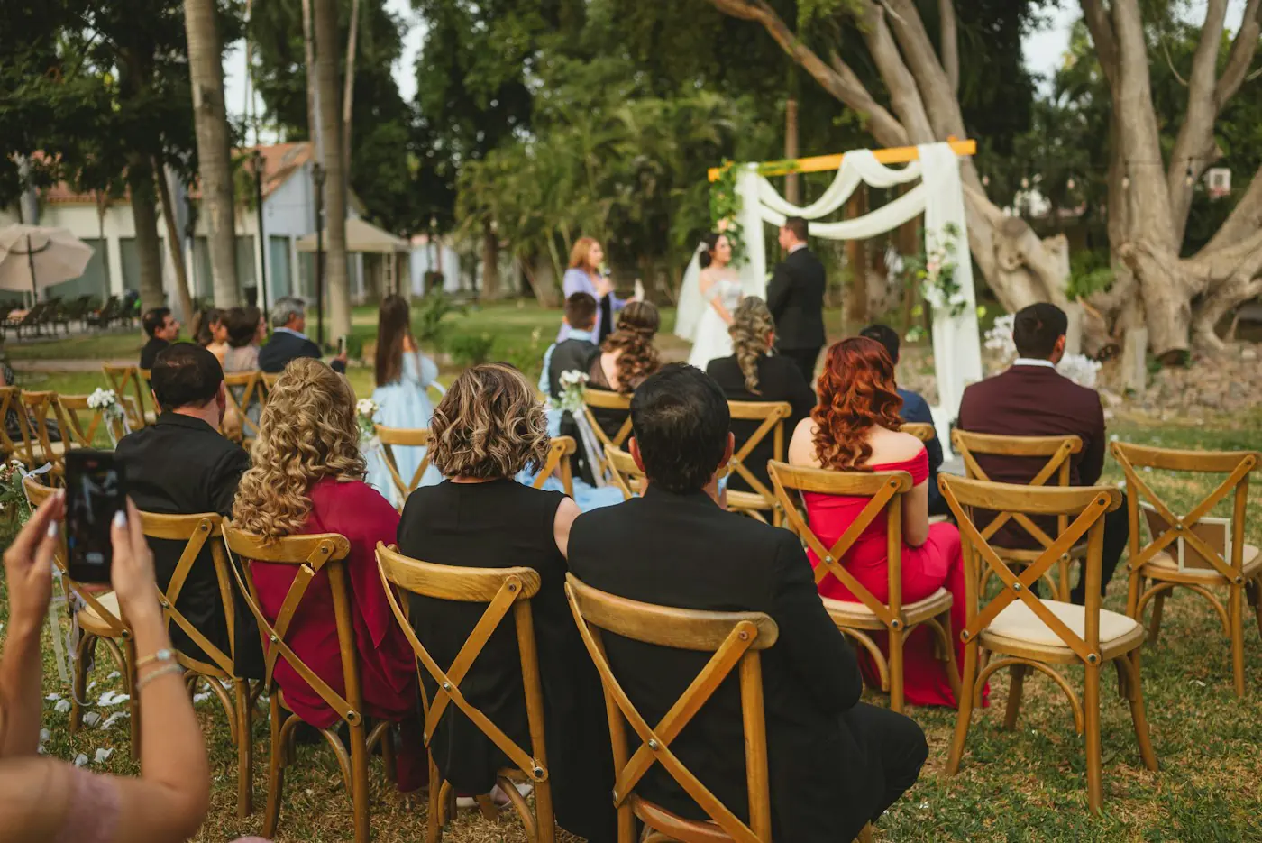Guests seated outdoors for a ceremony
