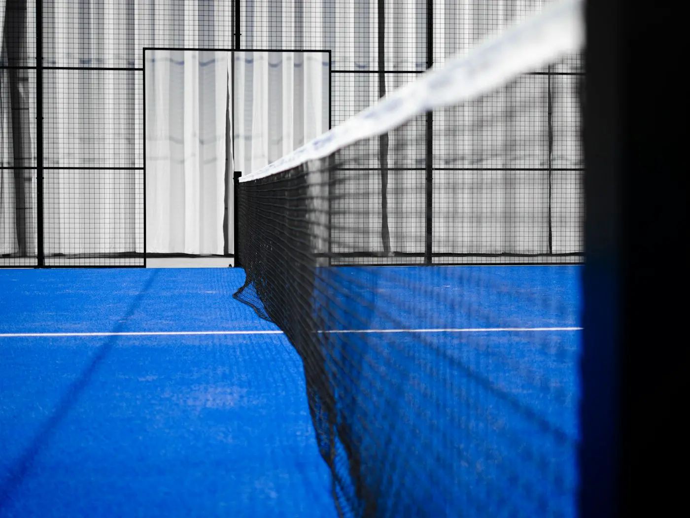 Padel court net and glass walls